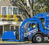 republic services garbage truck picking up garbage