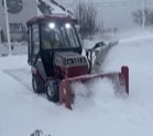 city plowing sidewalk