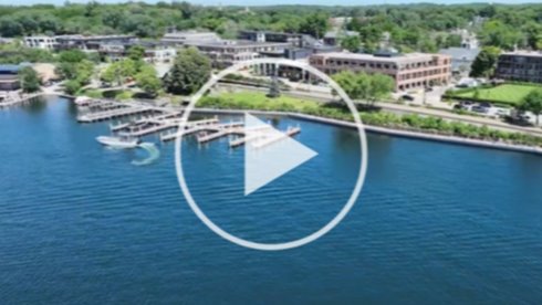 photo of the lake with a video play button to click on