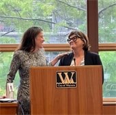 cathy iverson and mayor mayor mouton standing at the podium