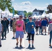 people walking on lake street at the wayzata art experience
