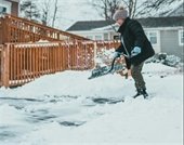 woman shoveling snow
