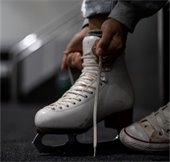 putting on ice skates