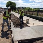 Pouring sidewalks along the south side of Lake Street