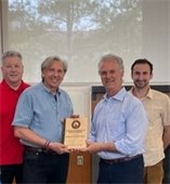 wayzata community church leaders holding an award for being the sustainability champion