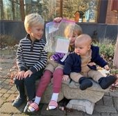 kids holding up the medallion