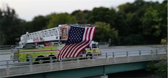 Wayzata Fire Department Presenting the US Flag on the Broadway bridge