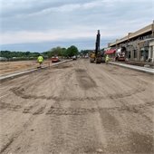 Grading for sidewalks and Plaza Park features, looking west on Lake Street