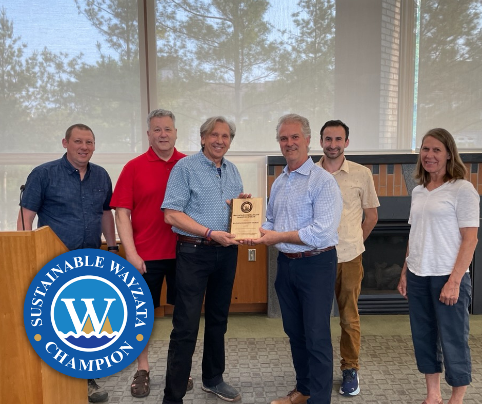 wayzata sustainability champion logo and an image of wayzata community church receiving their award